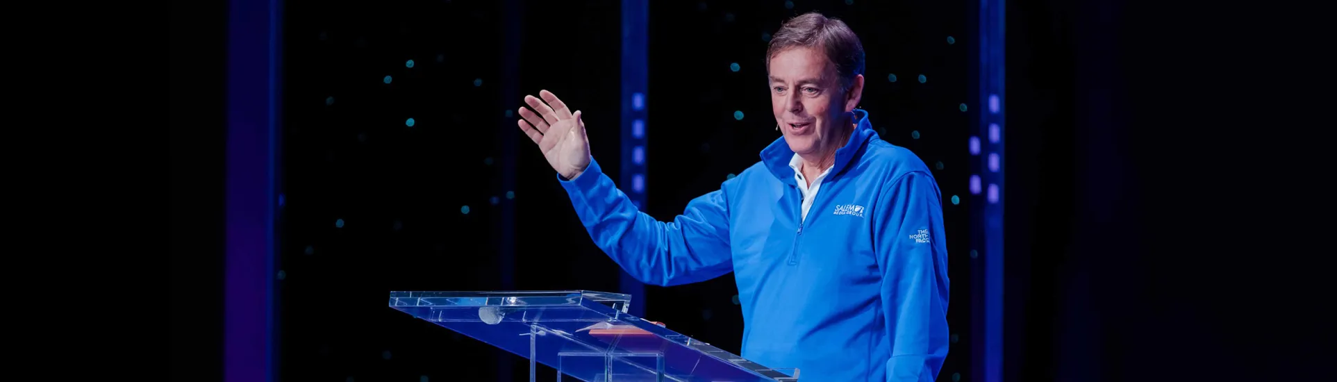 Alistair Begg speaking at a podium