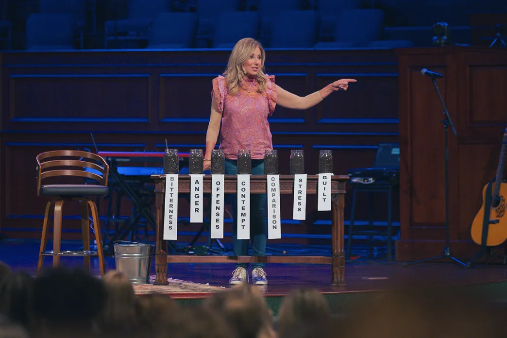 Beth Moore teaching on a stage