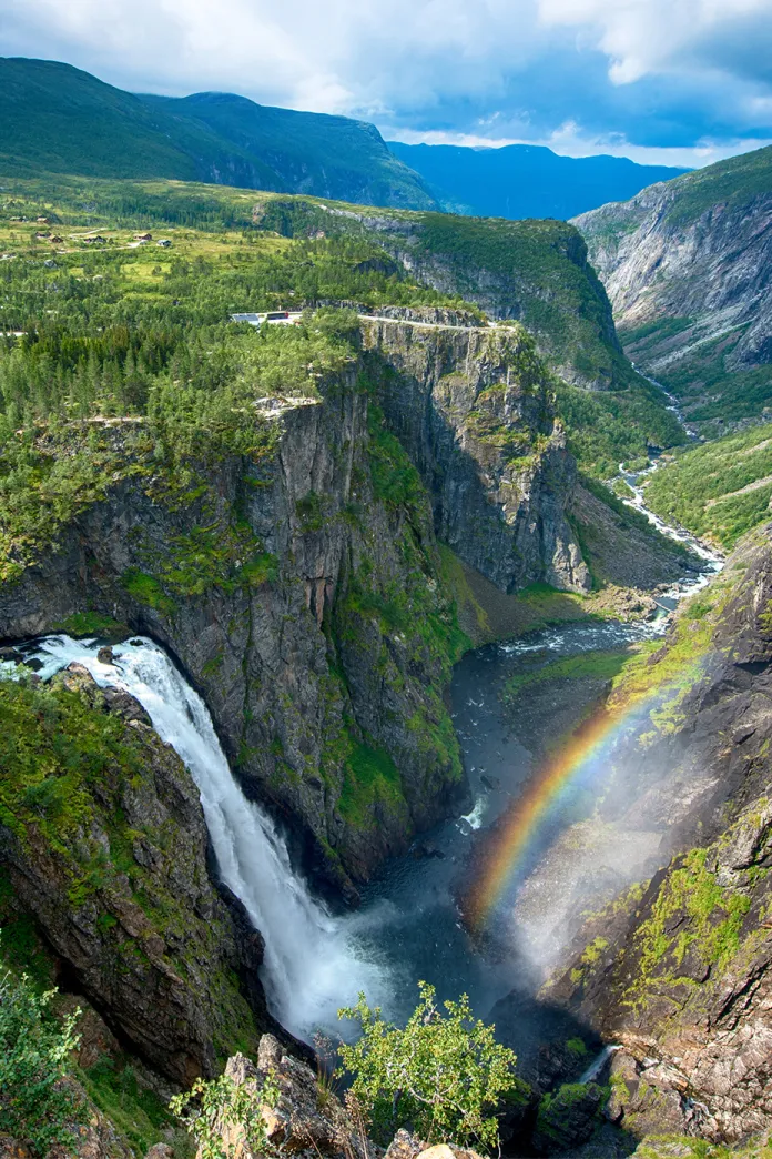 Waterfall and green mountains in Eidfjord